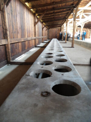 Inside the latrine barracks at Birkenau (notice the walls don’t touch the roof) @ Shelly Palmer